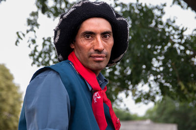 Portrait of young man wearing south american traditional clothing