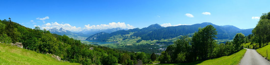 Panoramic view of trees and mountains against sky