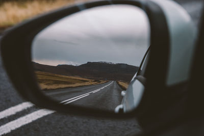 Reflection of road on side-view mirror 