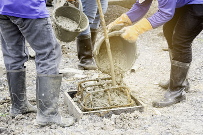 Low section of people working in water