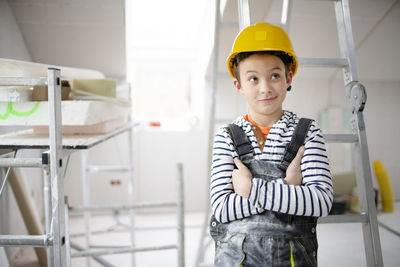 Portrait of young woman standing in laboratory