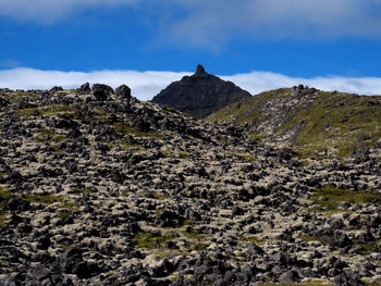 Low angle view of rock formations against sky