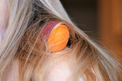 Close-up of woman with apricot