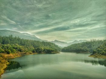 Scenic view of lake with mountains in background