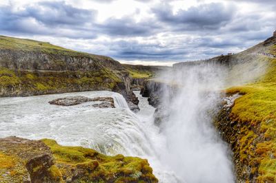 Scenic view of gullfoss waterfall against sky, iceland