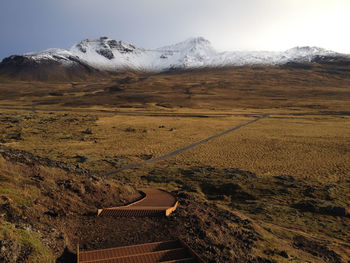 Scenic view of snowcapped mountains against sky