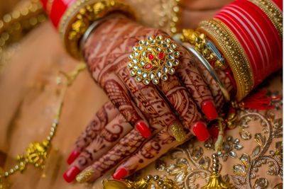 Midsection of bride wearing jewelries