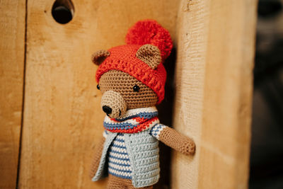 Close-up of stuffed toy against wall at home