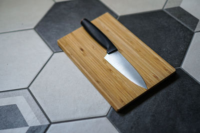 High angle view of cutting board on table