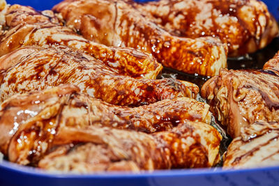 Marinated chicken legs with soy sauce in special bowl