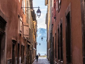 Narrow street amidst buildings in town