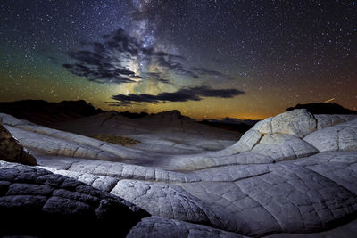 Scenic view of rocks against sky at night