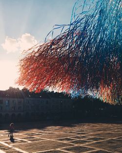 Man by building against sky