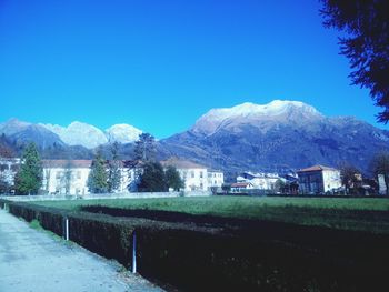 Scenic view of mountains against blue sky