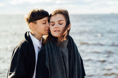 Close-up of father and son at beach