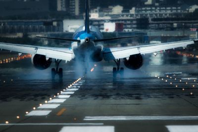 View of airplane at airport runway