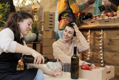 Female friends working at table