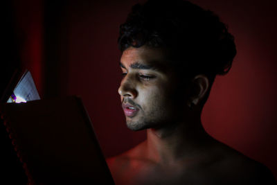 Portrait of young man using mobile phone