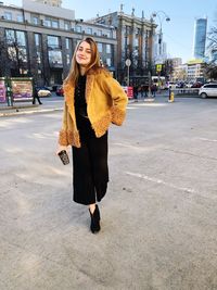 Young woman standing in city