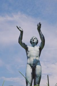 Low angle view of statue against sky