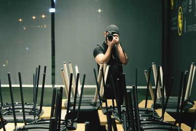 Full length of man photographing