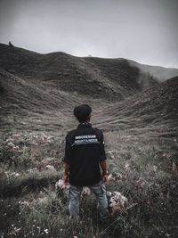 Rear view of man looking at mountains