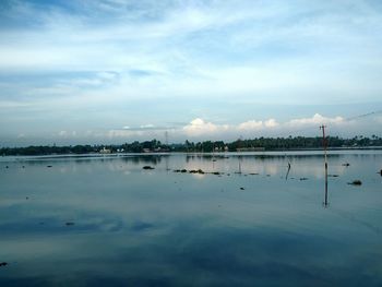 Sailboats in sea against sky