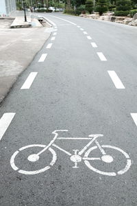 High angle view of arrow sign on road