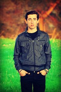 Portrait of young man standing on ground