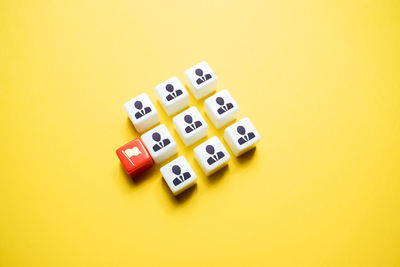 Close-up of dices on yellow background