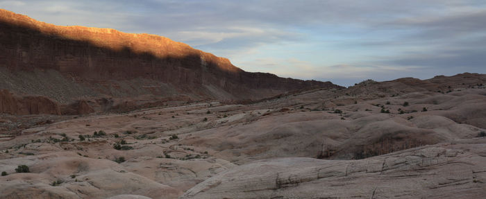 Scenic view of arid landscape against sky