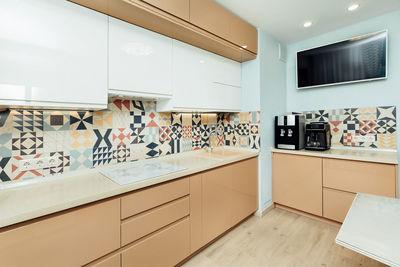 Beautiful beige modern kitchen with appliances