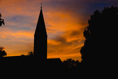 Silhouette temple against sky during sunset