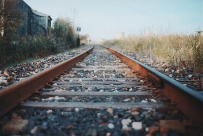 Surface level of railroad tracks against sky