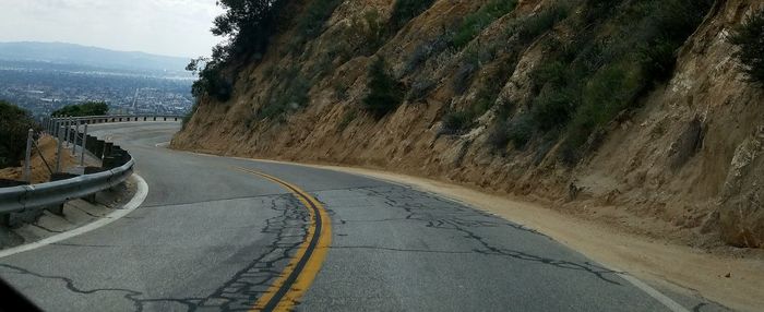 Road on landscape against sky