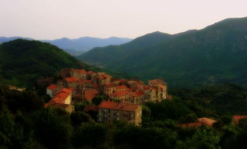 Houses on mountain range