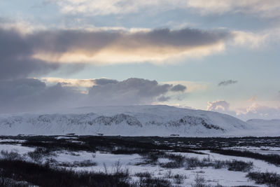 Scenic view of snowcapped mountains against sky