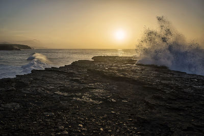 Scenic view of sea against sky during sunset