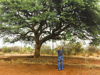 Rear view of man standing on field