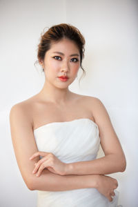 Portrait of a beautiful young woman over white background