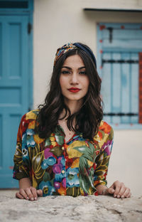 Portrait of young woman wearing hat