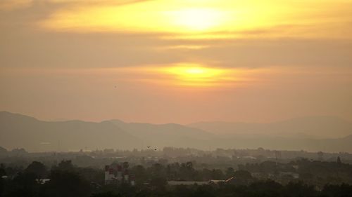 Scenic view of mountains against sky during sunset