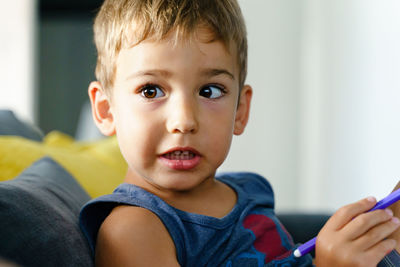 Portrait of cute boy at home