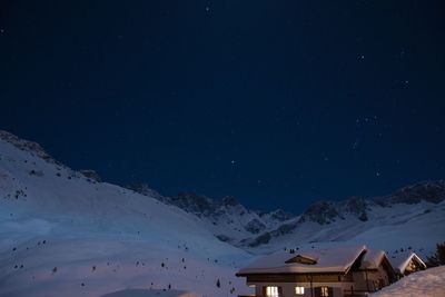 Scenic view of mountains against sky at night