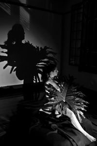 Man in illuminated room at home