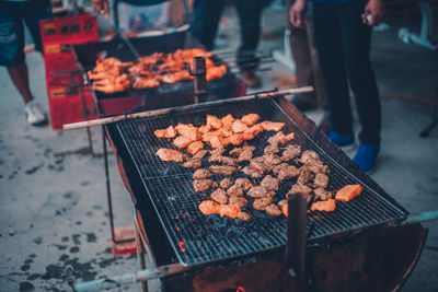 High angle view of meat on barbecue grill