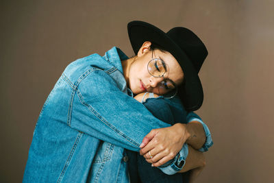 Portrait of a beautiful young woman wearing hat