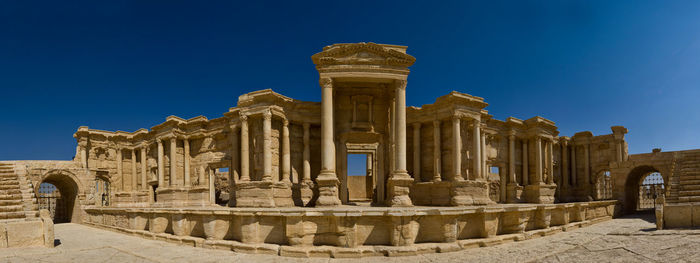 Temple against clear blue sky