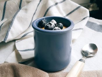 High angle view of sweet food in cup with napkin on table