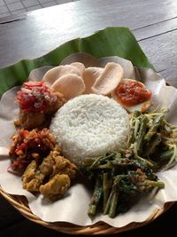 The uniqueness of local dishes in bali called nasi campur when you have it all in one plate.